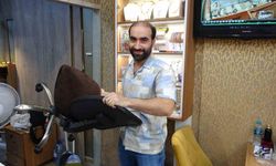 Silahlı soygun girişimini sandalye atarak engelledi... İşte o anlar