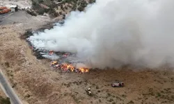 Kemalpaşa’da çöp yığınlarında çıkan yangın 5 saatte söndürüldü