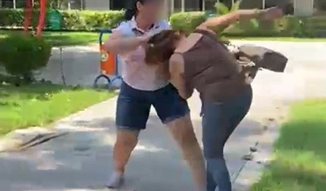 Kocasıyla birlikte parkta gördüğü kadını saçından sürükledi